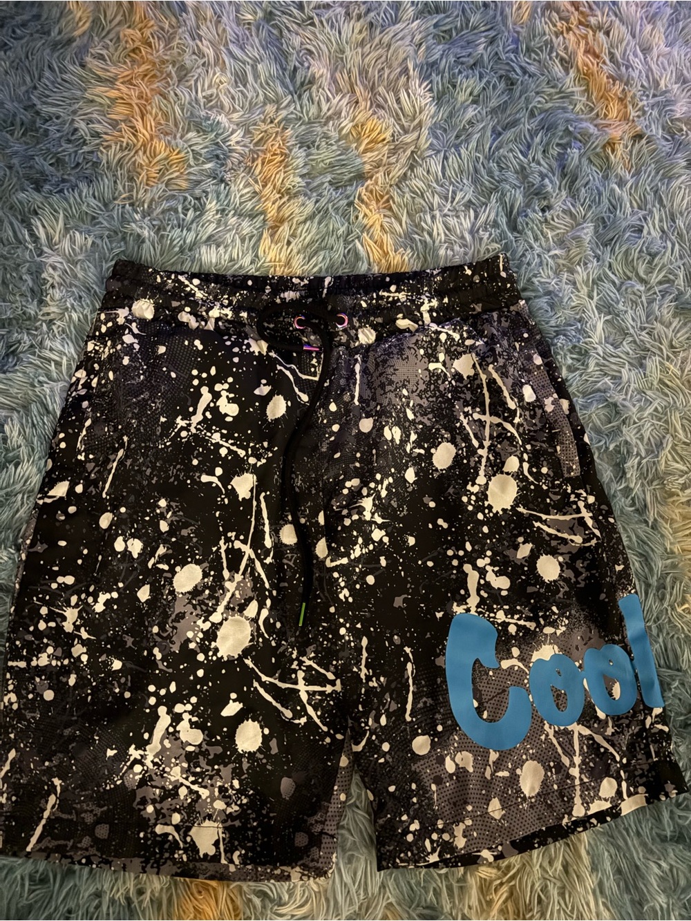 Men's Black Paint-Splash Athletic Shorts with Blue 'Cool' Accent